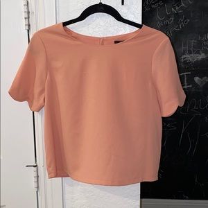 Beautiful peach top with scalloped sleeves